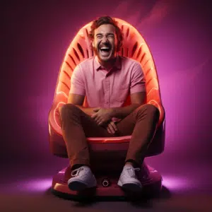 man sitting on a massager smiling and looking goofy
